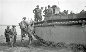 British Second Army engineers mount a Landing Vehicle Tracked (LVT) Water Buffalo for their Rhine crossing, March 23, 1945