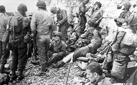 Operation Overlord: Seeking safety offered by a chalk cliff, Omaha Beach, June 8, 1944