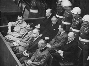Goering (far left) in the Nuremberg dock