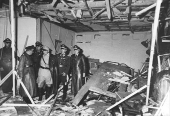 Hermann Goering (in khaki) showing visitors scene of destruction