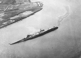 Capsized flagship Ōyodo, Kure Harbor, July 1945