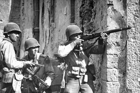 GI takes aim at German sniper, Cisterna, May 1944