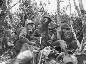 Battle of Peleliu: Marine throwing Molotov cocktail, "Suicide Ridge"