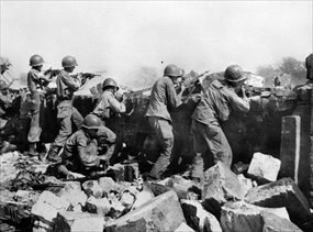 Battle of Manila: U.S. soldiers fire at Japanese troops, Intramuros, Feb. 23, 1945