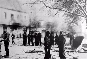 Greek Holocaust: German troops in front of buildings set ablaze in Distomo, June 10, 1944 Greek Holocaust: German troops in front of buildings set ablaze in Distomo, June 10, 1944
